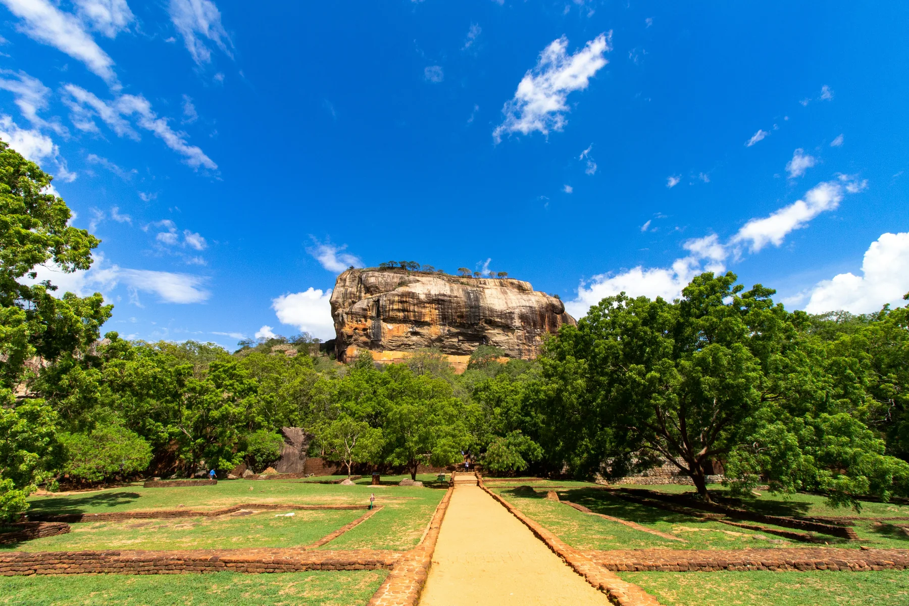 Sigiriya Rock rising above green landscape